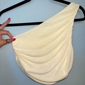 One shoulder, crop top with sheer fabric.